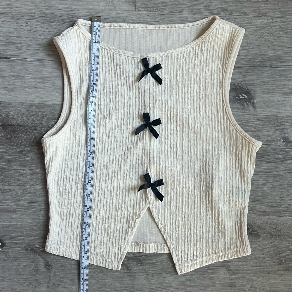Sleeveless Cream Top with Black Bow Accents